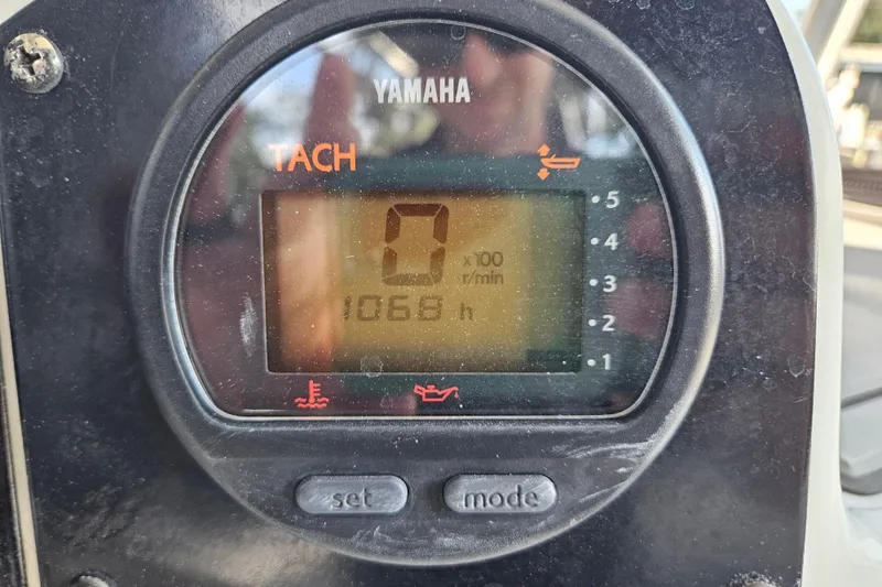 Slide: The Image of Yamaha tachometer displaying 1066 hours on a 2006 Polar 2700 Center Console boat. - 23