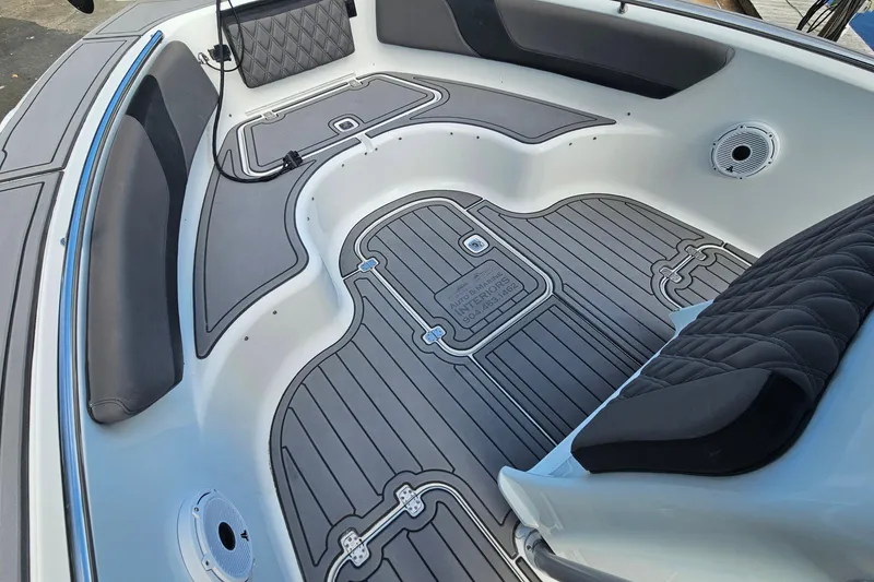 Slide: The Image of 2006 Polar 2700 Center Console boat interior with cushioned seating and non-slip flooring. - 28