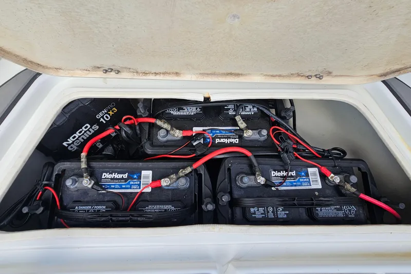 Slide: The Image of Batteries and charger in 2006 Polar 2700 Center Console boat compartment. - 34