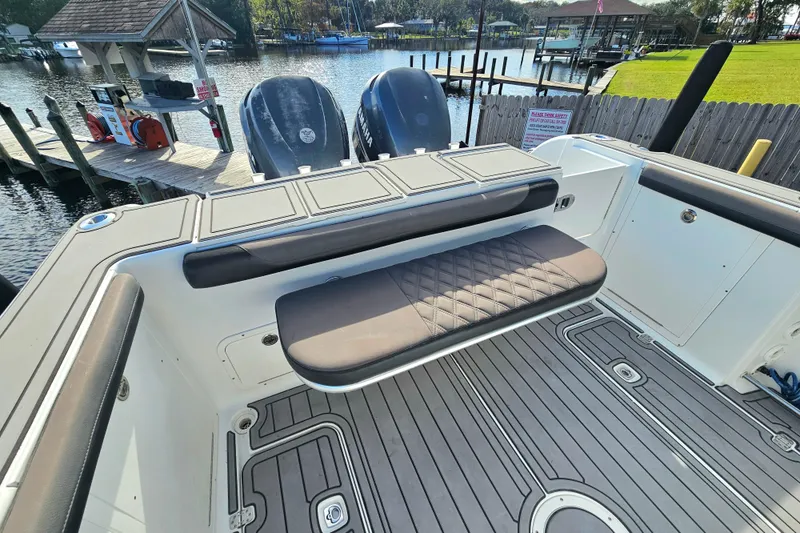 Slide: The Image of 2006 Polar 2700 Center Console boat with dual engines at a dock. - 7