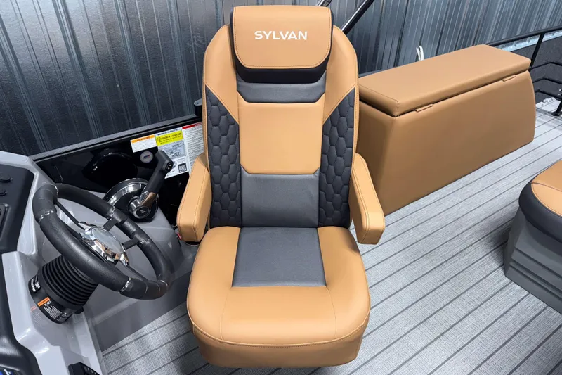 Slide: The Image of Captain's chair in 2026 Sylvan L3 CLZ DH boat, featuring tan and black upholstery. - 10