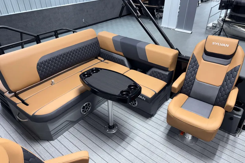 Slide: The Image of Luxurious interior of 2026 Sylvan L3 CLZ DH pontoon boat with tan and gray seating. - 17