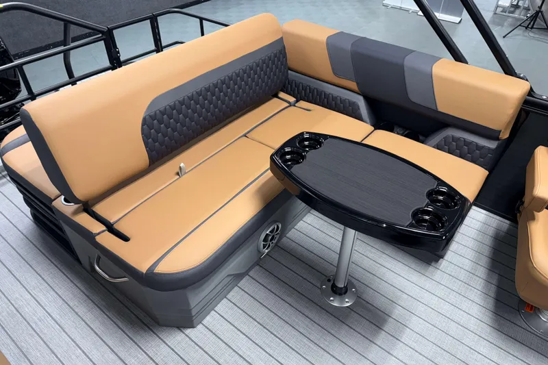 Slide: The Image of Luxurious seating area in 2026 Sylvan L3 CLZ DH boat with stylish table and cup holders. - 18
