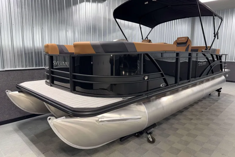 Slide: The Image of 2026 Sylvan L3 CLZ DH pontoon boat in showroom, featuring sleek design and modern seating. - 21