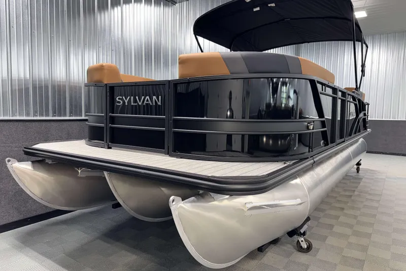 Slide: The Image of 2026 Sylvan L3 CLZ DH pontoon boat in showroom, featuring sleek design and modern amenities. - 23