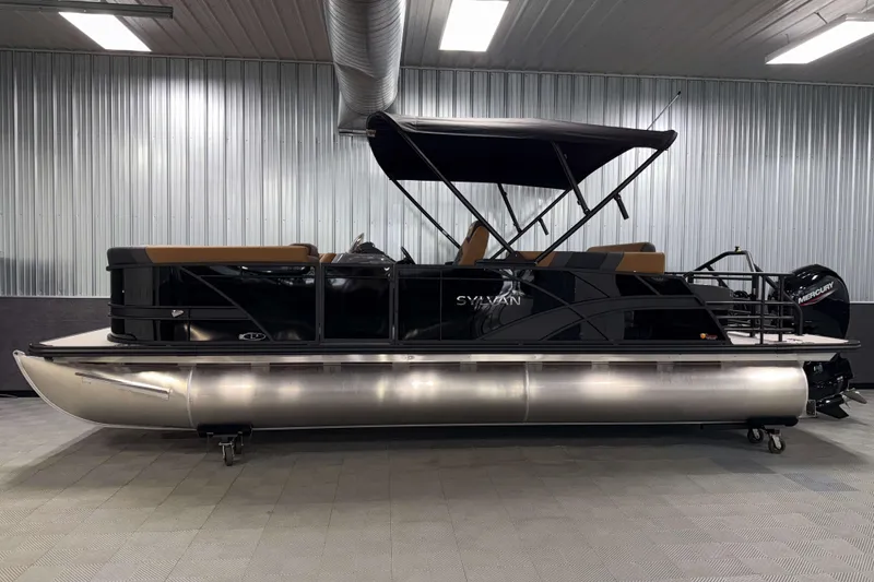 Slide: The Image of 2026 Sylvan L3 CLZ DH pontoon boat in a showroom with metallic finish. - 26
