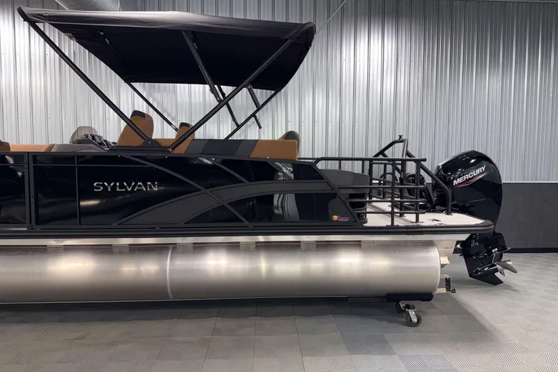 Slide: The Image of 2026 Sylvan L3 CLZ DH pontoon boat with Mercury outboard motor in showroom. - 27