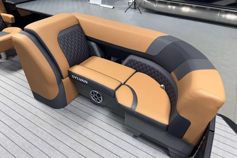 Slide: The Image of Luxurious seating on 2026 Sylvan L3 CLZ DH boat, featuring tan and gray upholstery. - 6