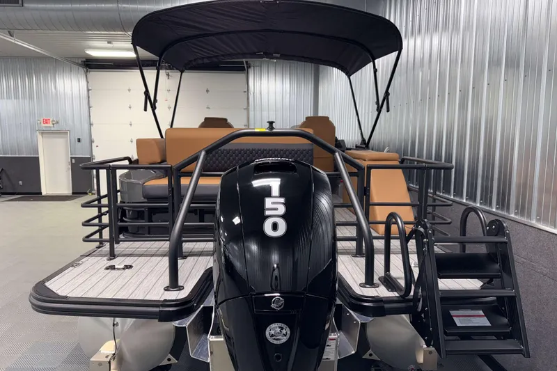 Slide: The Image of 2026 Sylvan L3 CLZ DH pontoon boat with 150 HP engine in a showroom. - 30