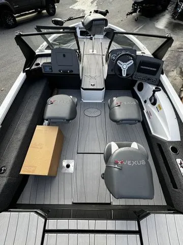 Slide: The Image of 2024 Vexus ADX190 boat interior with gray seating and modern dashboard. - 4