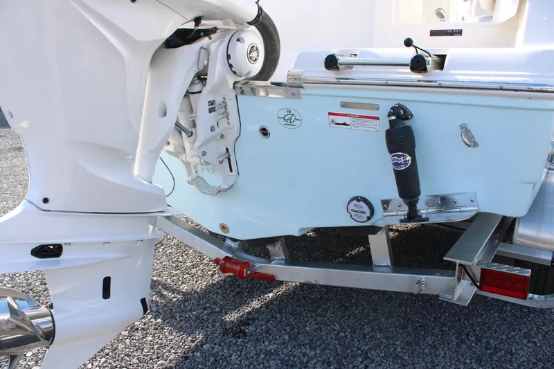 Slide: The Image of 2026 Sailfish 245 DC boat transom and outboard motor detail. - 15