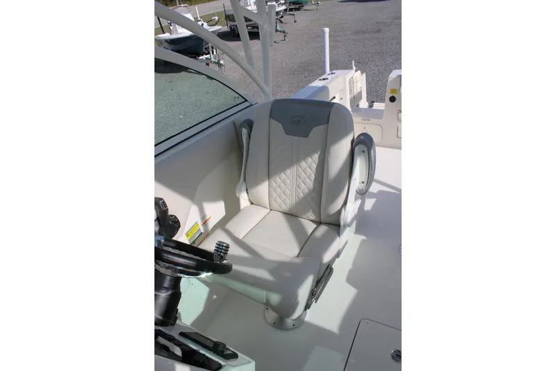 Slide: The Image of Captain's seat on 2026 Sailfish 245 DC boat, featuring elegant design and comfort. - 29