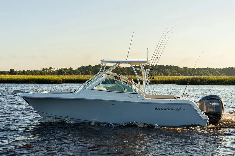 Slide: The Image of Manufacturer Provided Image: 2026 Sailfish 245 DC boat cruising on a calm river with scenic background. - 3