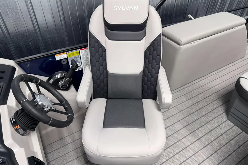 Slide: The Image of 2026 Sylvan L3 CLZ DH boat interior with modern captain's chair and steering wheel. - 10