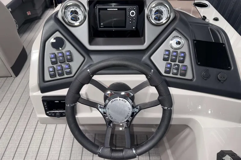 Slide: The Image of 2026 Sylvan L3 CLZ DH boat dashboard with steering wheel and control panel. - 11