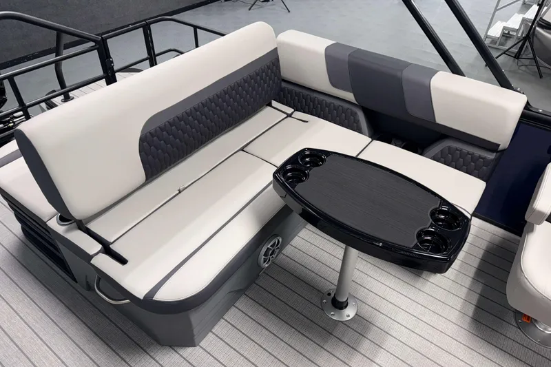 Slide: The Image of Luxurious seating area on 2026 Sylvan L3 CLZ DH pontoon boat with sleek table design. - 15