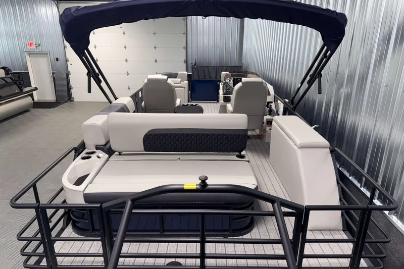 Slide: The Image of 2026 Sylvan L3 CLZ DH pontoon boat with canopy in a showroom. - 17