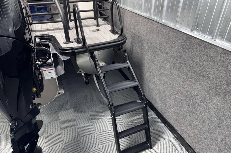 Slide: The Image of Rear view of 2026 Sylvan L3 CLZ DH boat with ladder and engine detail. - 25