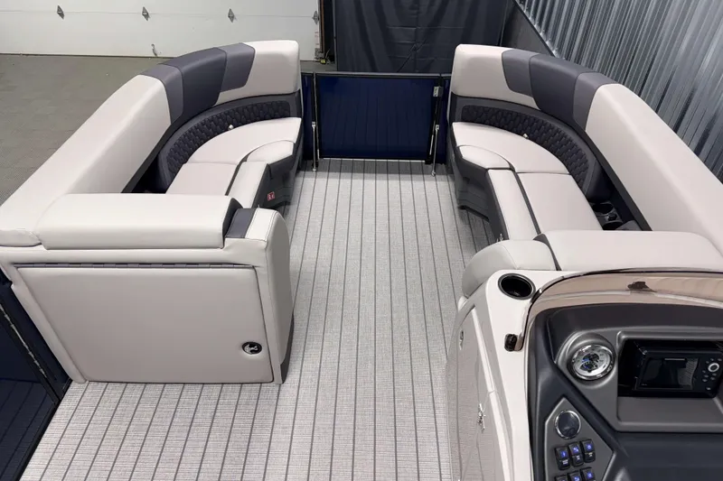 Slide: The Image of Luxurious interior of 2026 Sylvan L3 CLZ DH pontoon boat with plush seating and modern dashboard. - 6