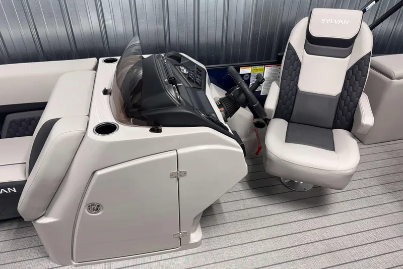 Slide: The Image of 2026 Sylvan L3 CLZ DH boat interior with steering console and captain's chair. - 8