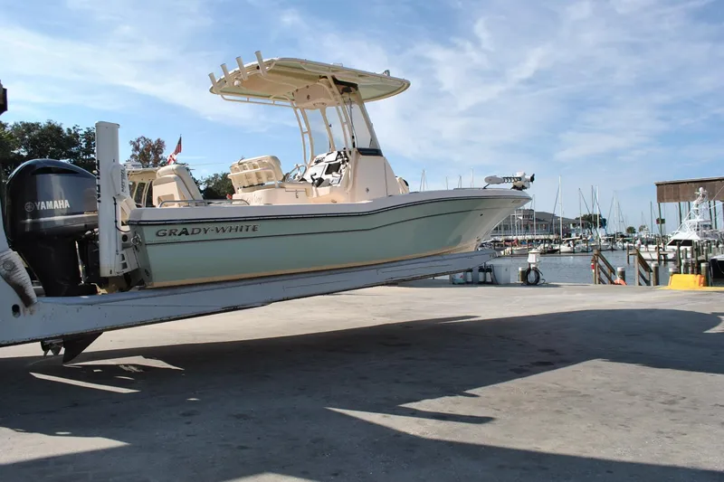 Slide: The Image of 2021 Grady-White 251 Coastal Explorer boat with T-top against clear blue sky. - 23