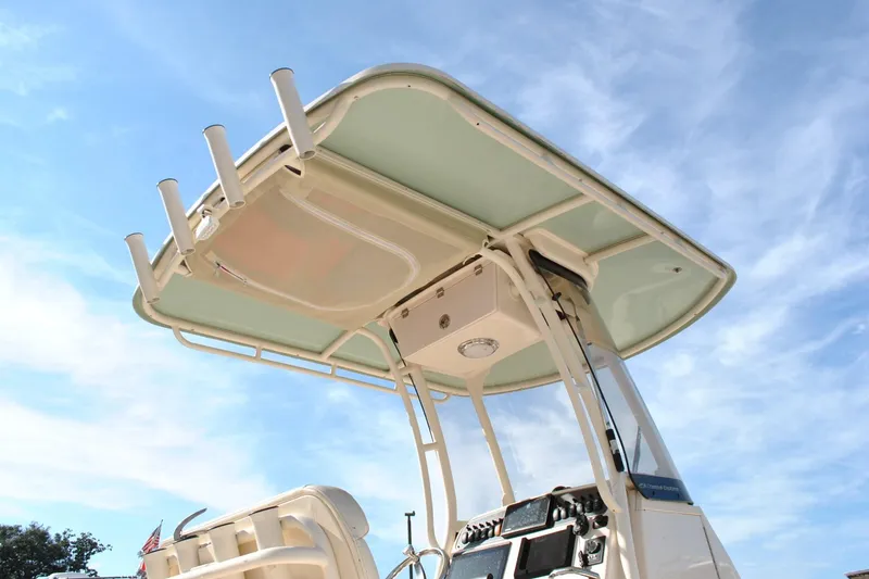 Slide: The Image of 2021 Grady-White 251 Coastal Explorer boat docked at a marina, clear blue sky. - 24