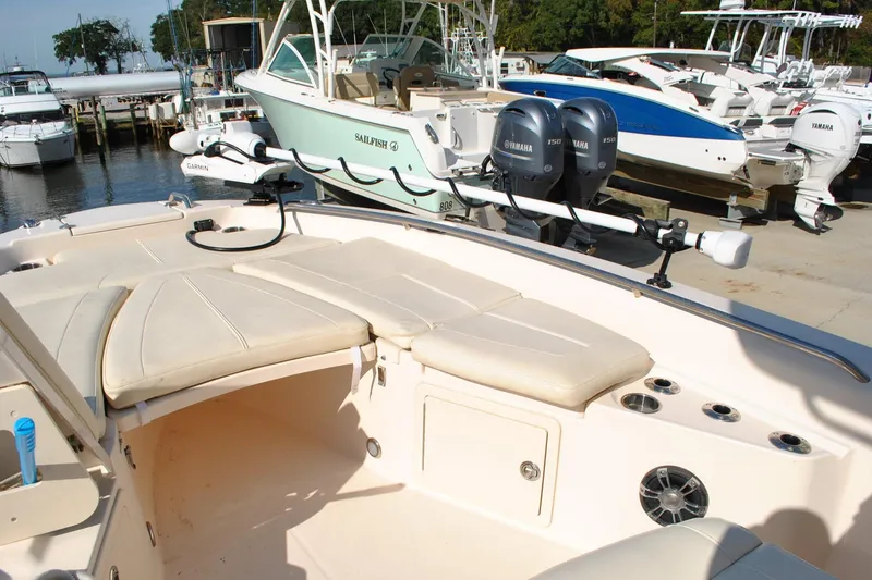 Slide: The Image of 2021 Grady-White 251 Coastal Explorer boat at a marina with other boats. - 29