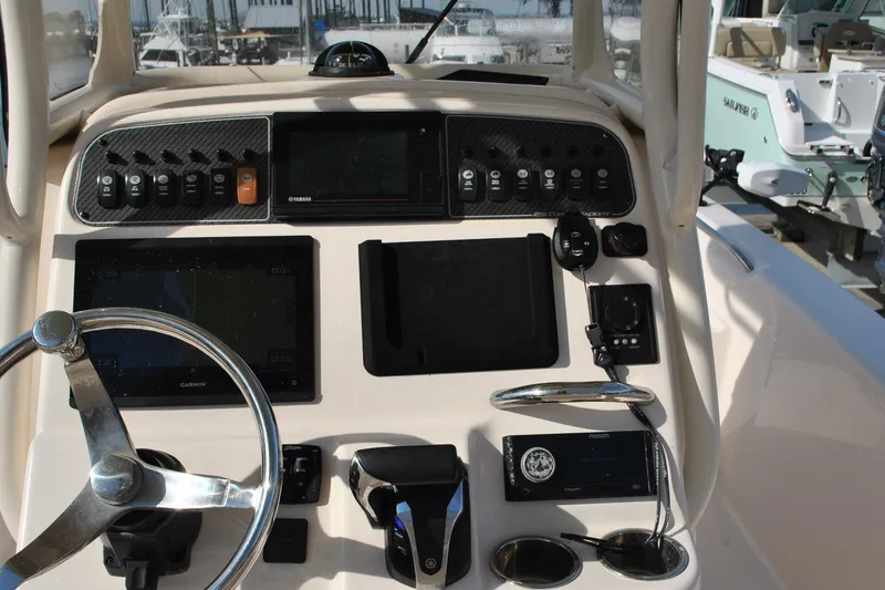 Slide: The Image of 2021 Grady-White 251 Coastal Explorer boat with Yamaha 300 engine, featuring comfortable seating. - 35