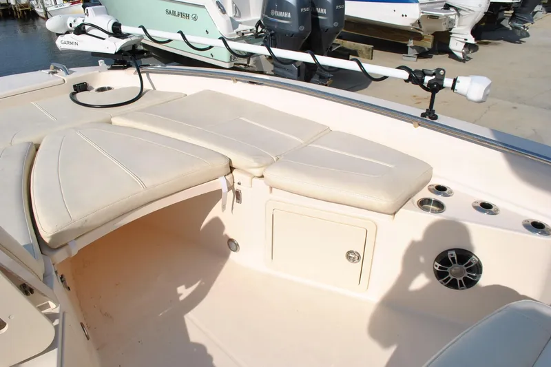 Slide: The Image of 2021 Grady-White 251 Coastal Explorer boat dashboard with steering wheel and controls. - 36