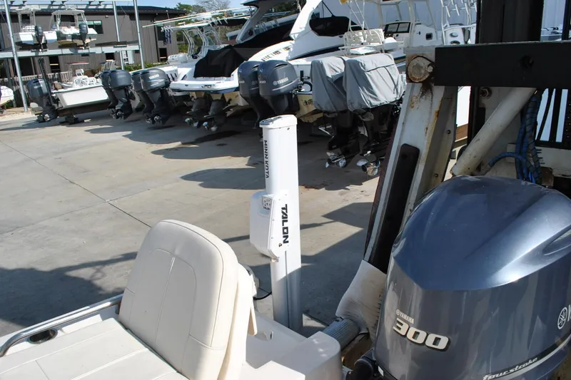 Slide: The Image of Control panel of 2021 Grady-White 251 Coastal Explorer boat with switches and remote. - 41