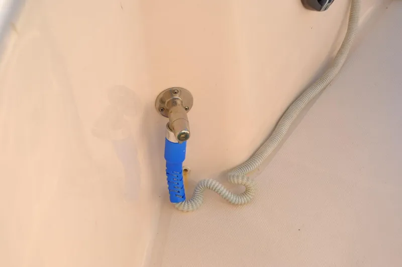 Slide: The Image of 2021 Grady-White 251 Coastal Explorer boat seat with beige upholstery and rope. - 47