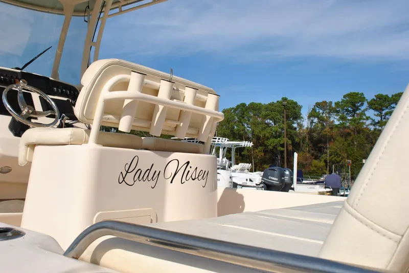 Slide: The Image of 2021 Grady-White 251 Coastal Explorer boat storage compartment with open door. - 50