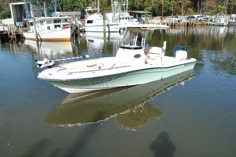 Slide: The Image of 2021 Grady-White 251 Coastal Explorer boat docked in a marina. - 60