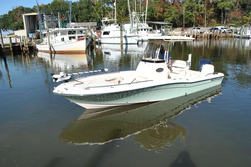 Slide: The Image of 2021 Grady-White 251 Coastal Explorer boat docked in a marina. - 61
