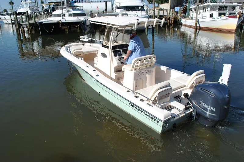 Slide: The Image of 2021 Grady-White 251 Coastal Explorer boat with Yamaha engine in marina. - 62