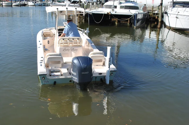 Slide: The Image of 2021 Grady-White 251 Coastal Explorer boat with Yamaha engine in marina. - 65