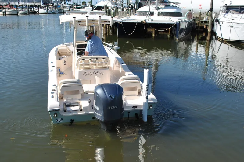 Slide: The Image of 2021 Grady-White 251 Coastal Explorer boat docked, featuring Yamaha 300 engine. - 66