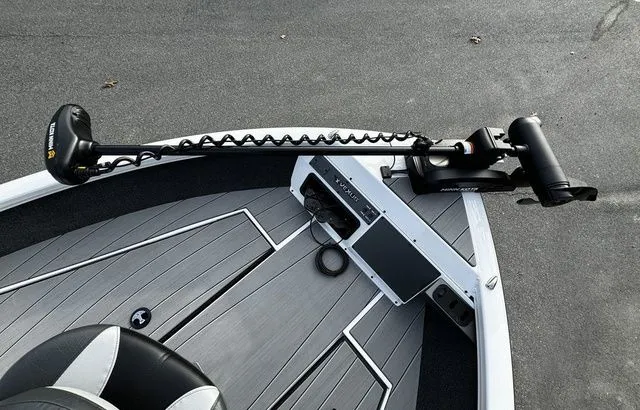 Slide: The Image of 2024 Vexus ADX190 boat deck with trolling motor and sleek design. - 11