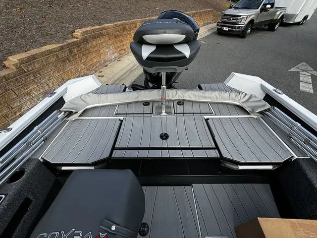 Slide: The Image of 2024 Vexus ADX190 boat interior with sleek seating and storage compartments. - 14
