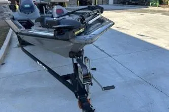 Slide: The Image of 2014 Tracker Pro Team 190 TX boat on trailer in driveway. - 3