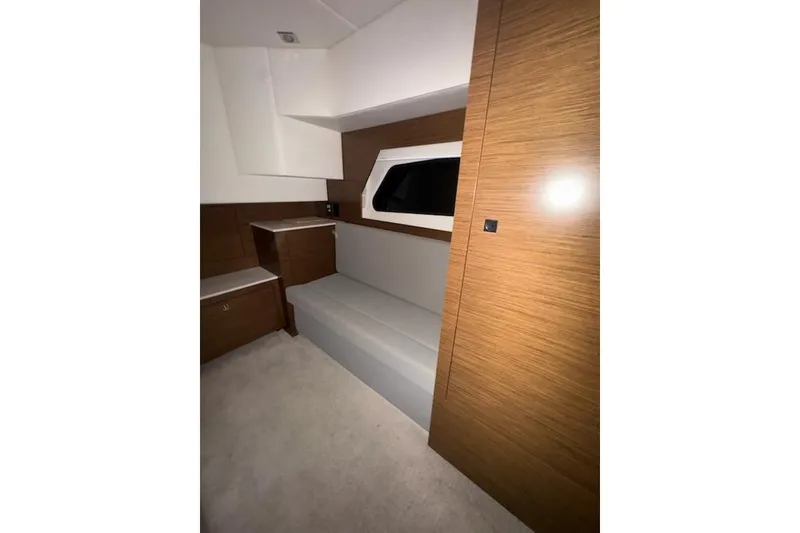 Slide: The Image of 2016 Cruisers 390 Express interior with modern wood finish and seating area. - 8