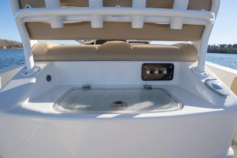 Slide: The Image of 2020 NauticStar 2602 Legacy boat interior with seating and control panel. - 10