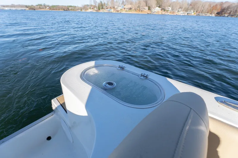 Slide: The Image of 2020 NauticStar 2602 Legacy boat on calm lake waters. - 11