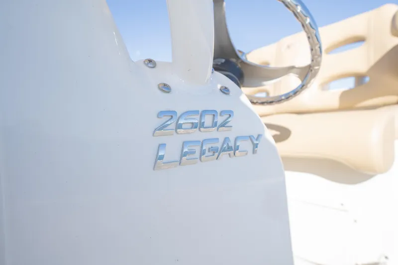 Slide: The Image of 2020 NauticStar 2602 Legacy boat emblem and steering wheel detail. - 18