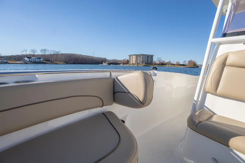 Slide: The Image of 2020 NauticStar 2602 Legacy boat interior with lake view and distant buildings. - 5