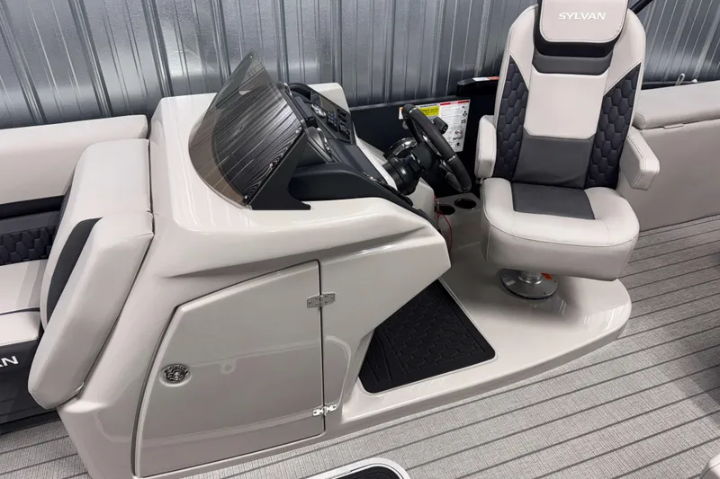 Slide: The Image of 2026 Sylvan L3 CLZ DH Platinum boat interior with sleek helm and comfortable captain's chair. - 10