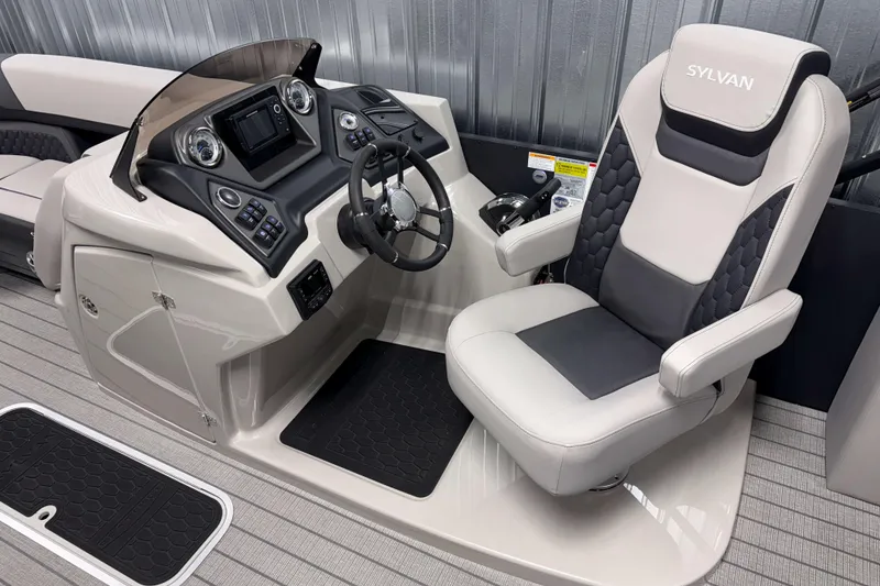 Slide: The Image of Interior of 2026 Sylvan L3 CLZ DH Platinum boat with modern helm and captain's chair. - 11