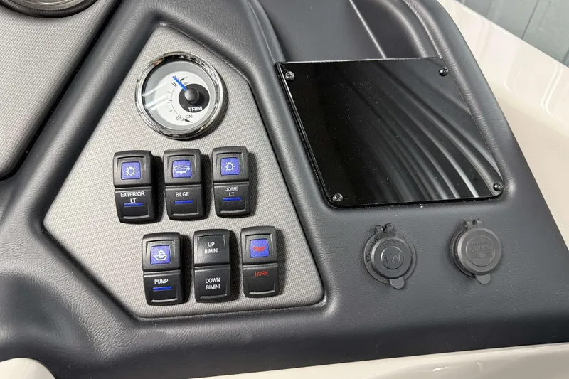 Slide: The Image of Control panel of 2026 Sylvan L3 CLZ DH Platinum boat with switches and gauge. - 16
