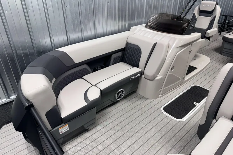 Slide: The Image of 2026 Sylvan L3 CLZ DH Platinum boat interior with luxurious seating and modern design. - 2
