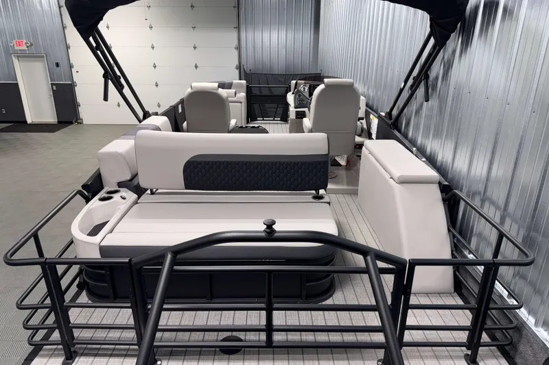 Slide: The Image of 2026 Sylvan L3 CLZ DH Platinum pontoon boat interior with seating and helm. - 20